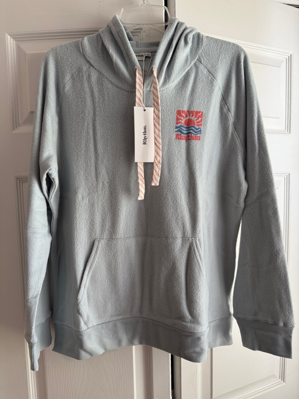 Rhythm. Women's Light Blue Pullover Hoodie with Coral Logo